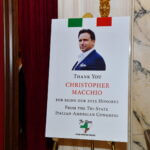Sign saluting honoree Christopher Macchio at the June 2025 dinner